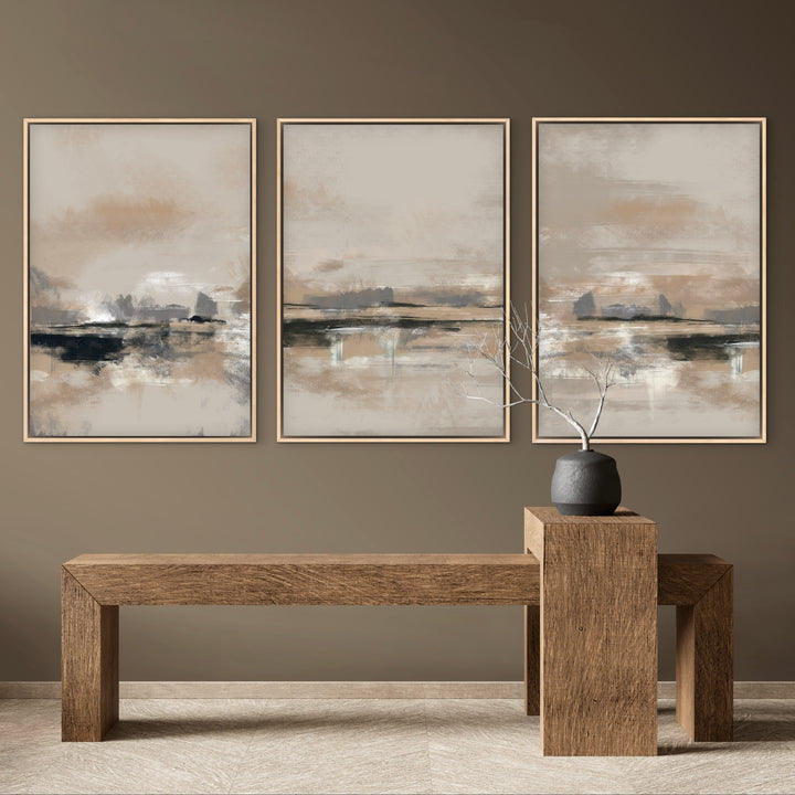 Modern Abstract Art Framed Canvas Triptych Styled with a Solid Wood Minimalist Bench, a Charcoal Ceramic Vase with Branches, and a Warm Taupe Wall. Perfect for a Minimalist Entryway.