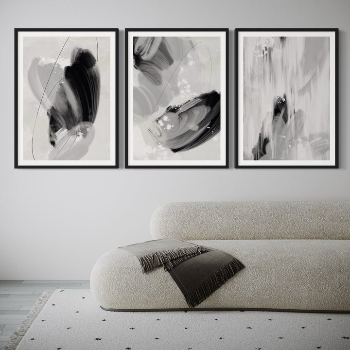 Modern Abstract Art Styled With A Curved Bouclé Chaise, White Frames, Soft Grey Wall, And A Minimal Speckled Rug. Perfect For A Minimalist Living Room.