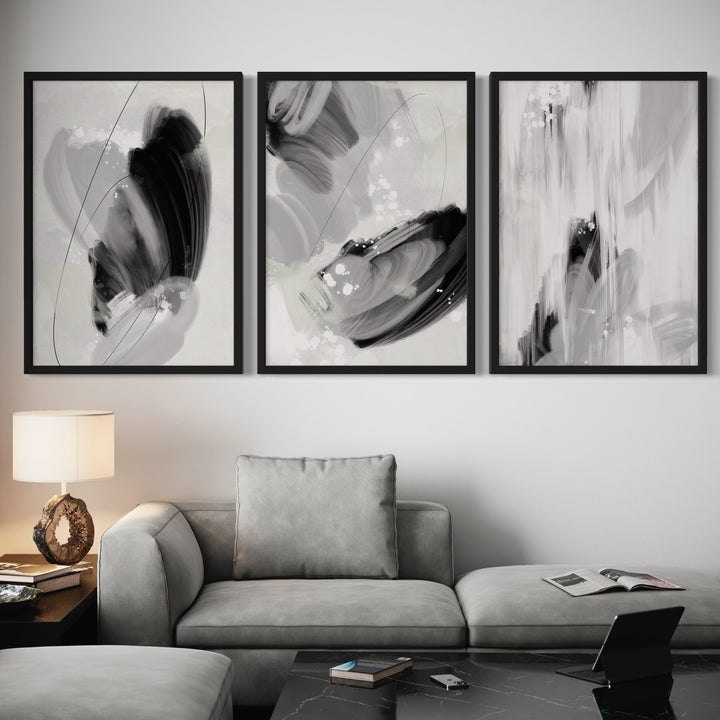 Modern Abstract Art Styled With A Soft Grey Sectional, Black Marble Coffee Table, Warm Table Lamp, And Minimal Accents. Perfect For A Minimalist Living Room.