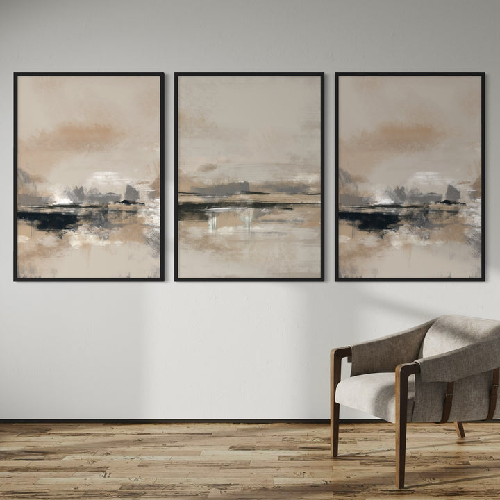 Modern Abstract Art Triptych Styled with a Mid-Century Wood Armchair, Warm Wood Plank Flooring, and a Clean White Wall. Perfect for a Minimalist Living Room.