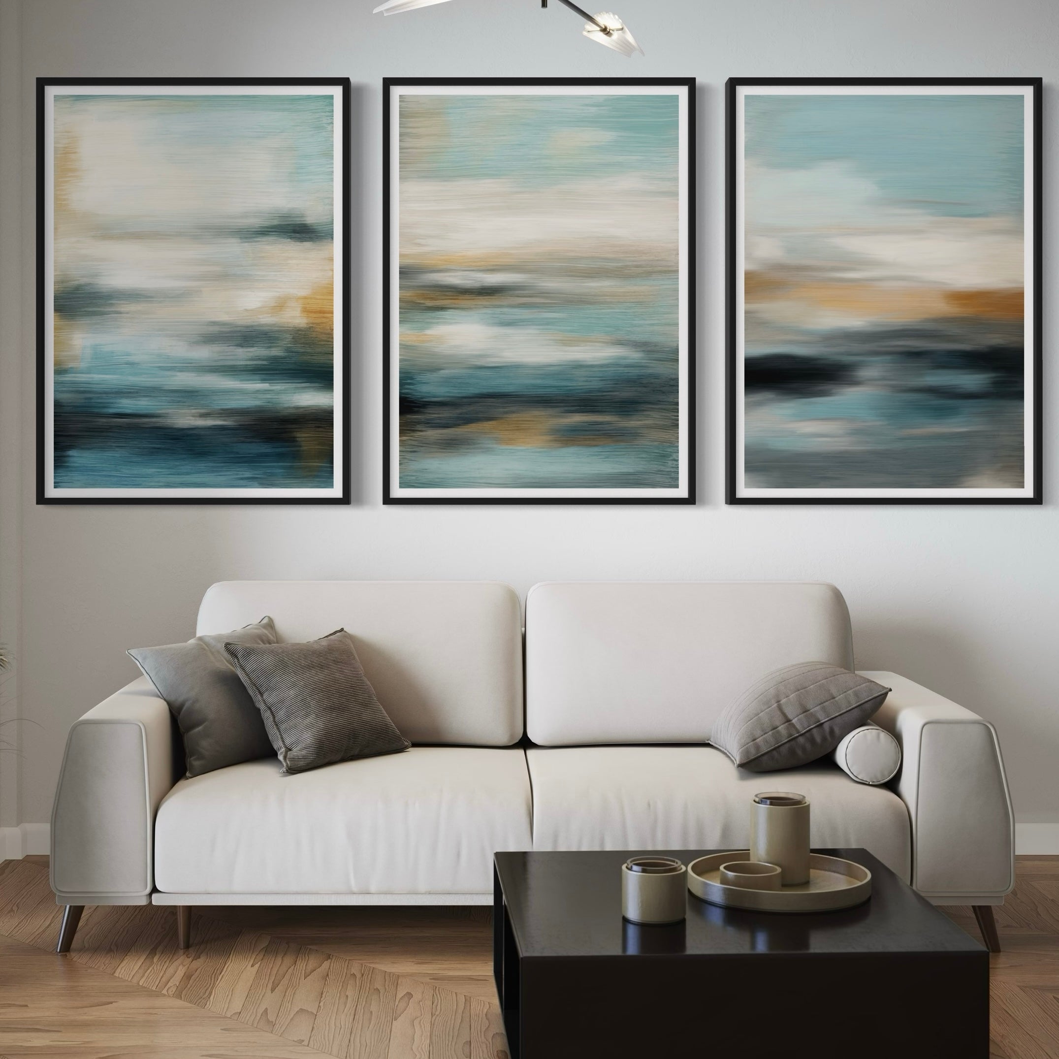 Modern Abstract Art Styled with a Cream Sofa, Grey Throw Pillows, a Black Coffee Table with a Decorative Accent, and Warm Wood Flooring. Perfect for a Minimalist Living Room.