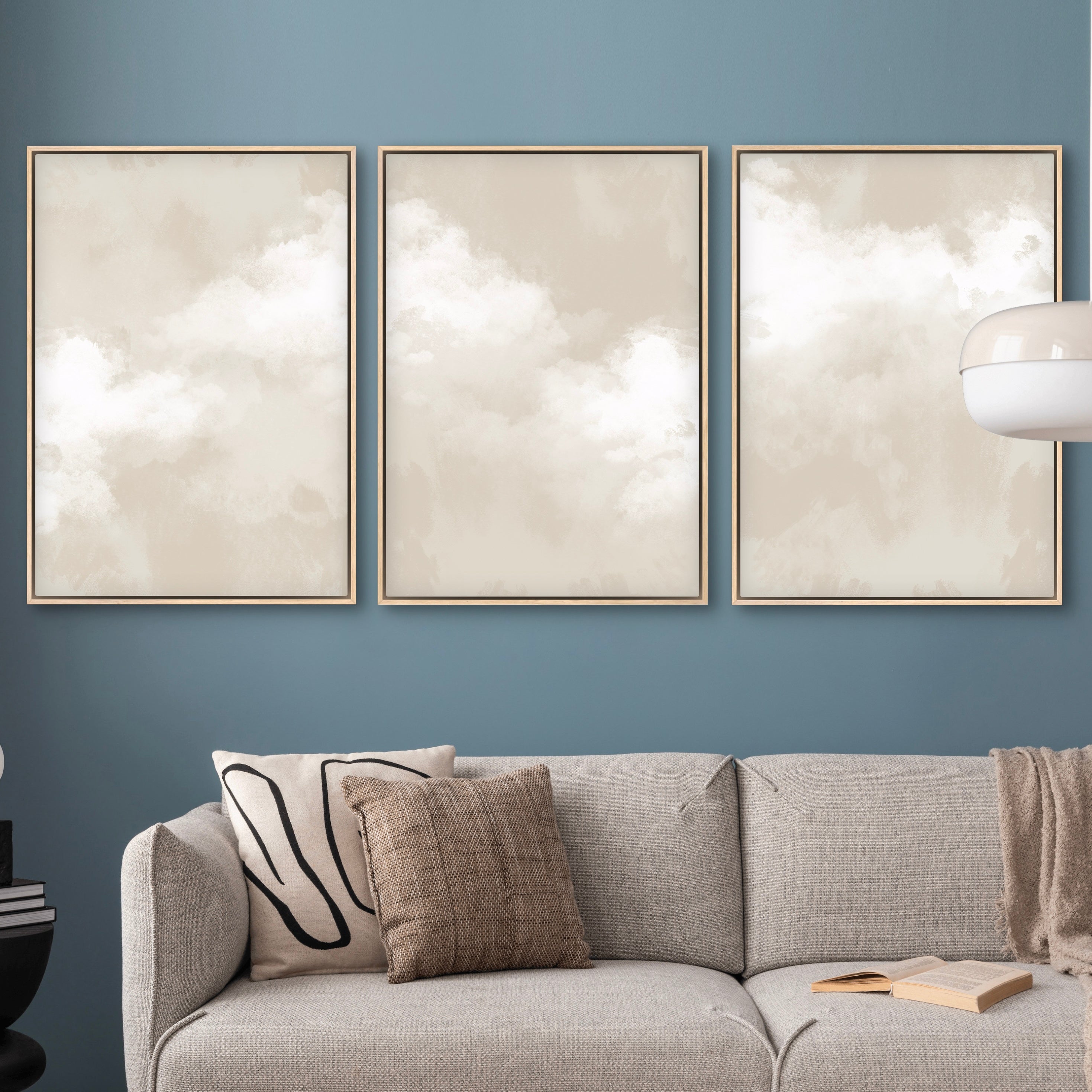 Modern Abstract Art Framed Canvas Styled with a Grey Textured Sofa and  Throw Pillows, Blue-Grey Wall, Black Side Table and White Lamp. Perfect for a Minimalist Living Room.