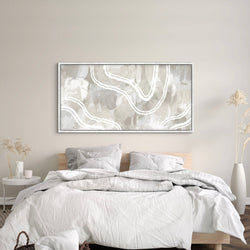 Elegant modern framed canvas wall art above the bed, complemented by flower vases on each bedside.