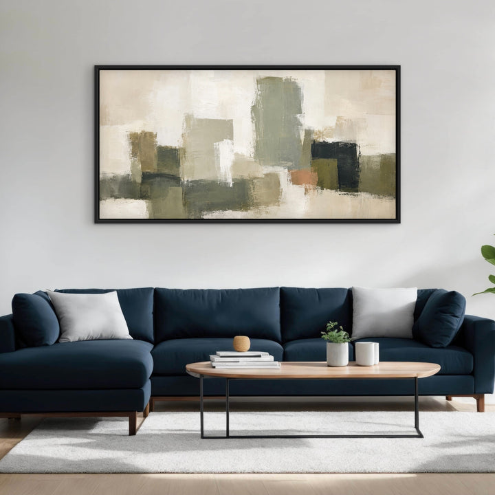 Atelier Blocks green abstract panoramic canvas above a deep navy sofa