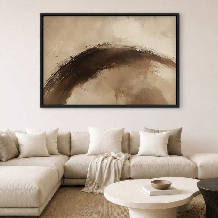 Cacao Gesture brown brushstroke framed canvas above cream sectional, black frame