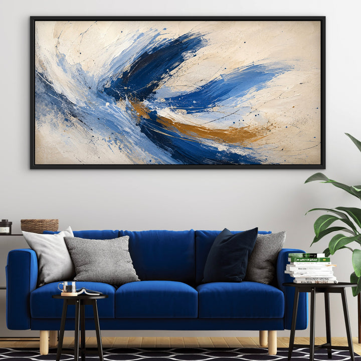 Cobalt Flight blue and gold panoramic abstract framed canvas above a vivid blue sofa