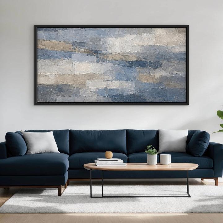 Denim Quarry blue grey panoramic abstract framed canvas above a navy sofa