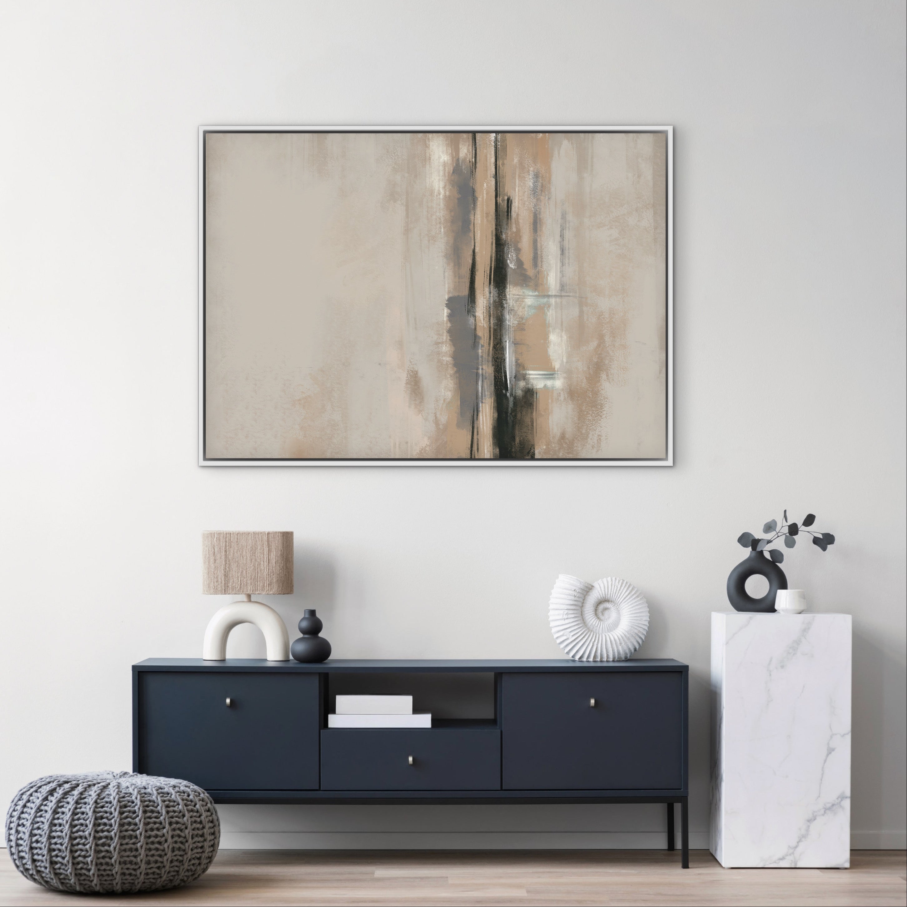 Abstract Wall Art Styled With A Deep Navy Console, Knit Pouf, Arched Ceramic Lamp, White Nautilus Sculpture, And Marble Pedestal With Eucalyptus. Perfect For A Contemporary Entryway Or Minimalist Hallway.