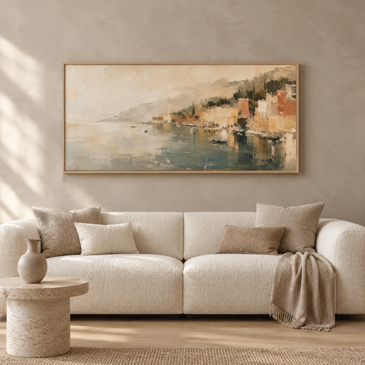 Auremare coastal panoramic framed canvas in a natural oak frame above a cream boucle sofa