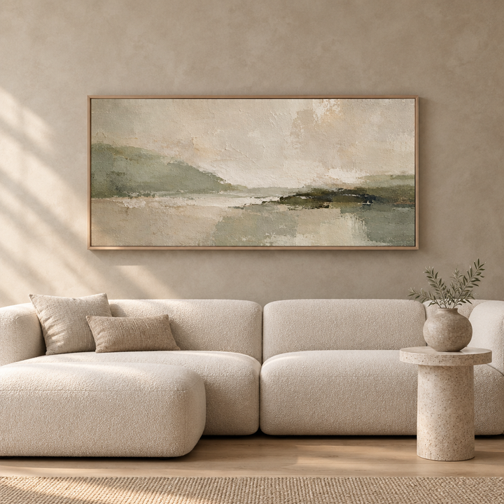 Green Essence sage green panoramic framed canvas in a natural oak frame above a cream boucle sofa