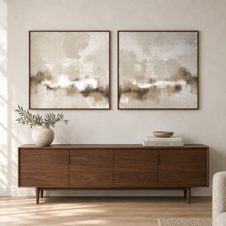Sorrento set of two neutral abstract framed canvases in brown wooden frames above a walnut credenza