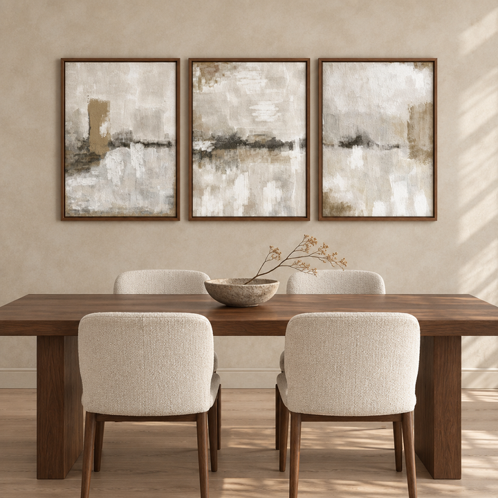 Nude Clouds set of three abstract framed canvases in brown wooden frames above a walnut dining table