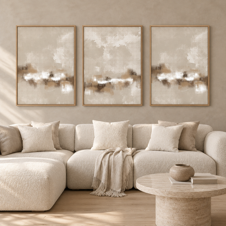 Sorrento set of three framed canvases in natural oak frames above a cream boucle sofa