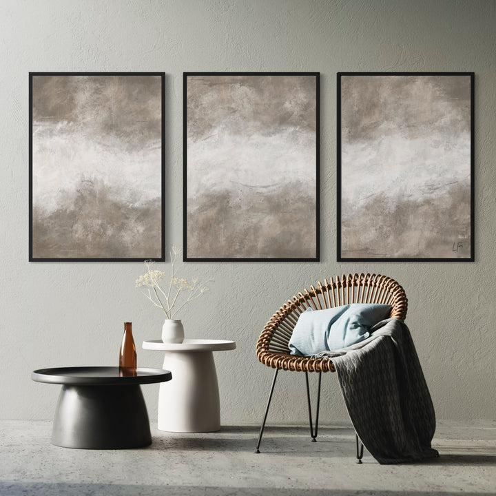 Earth-Toned Abstract Wall Art Styled With A Woven Rattan Accent Chair, Sculptural Side Tables, And Soft Neutral Decor. Perfect For A Contemporary Living Room.