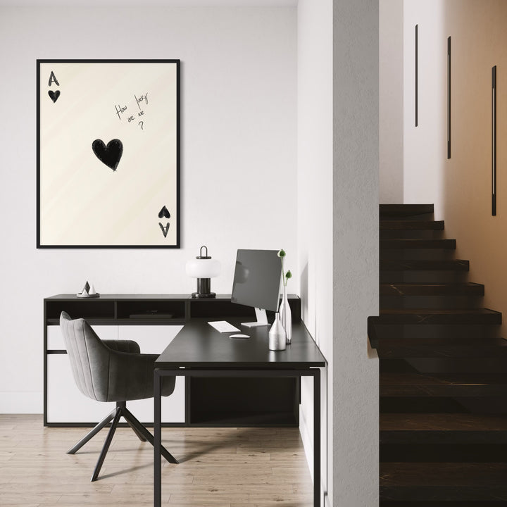 Ace Of Hearts Minimalist Print – Modern Minimal Style Styled With A Sleek Black Desk, Grey Swivel Chair, Soft-Glow Table Lamp, Slim Metal Vases, And Dark Staircase Accents. Perfect For A Contemporary Home Office Or Hallway Niche.