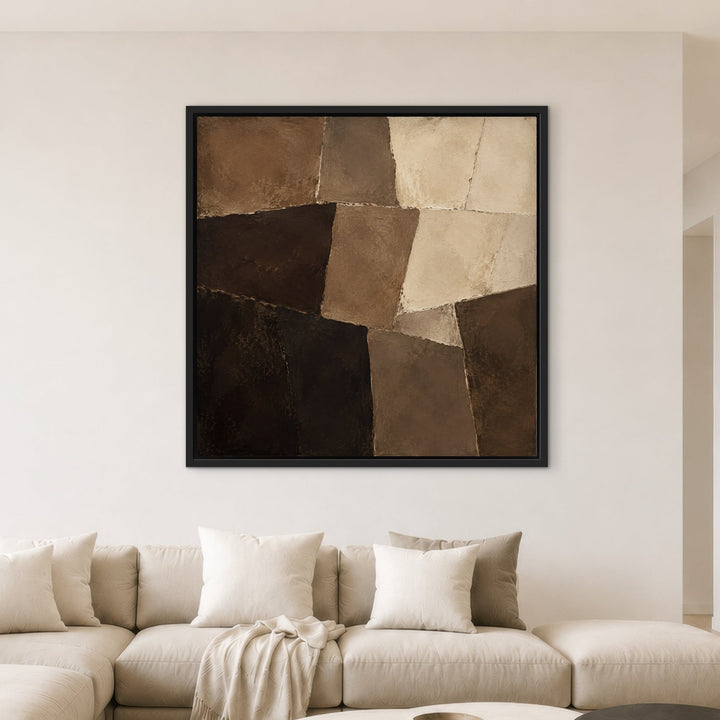 Mocha Mosaic brown patchwork framed canvas above cream sectional, black frame