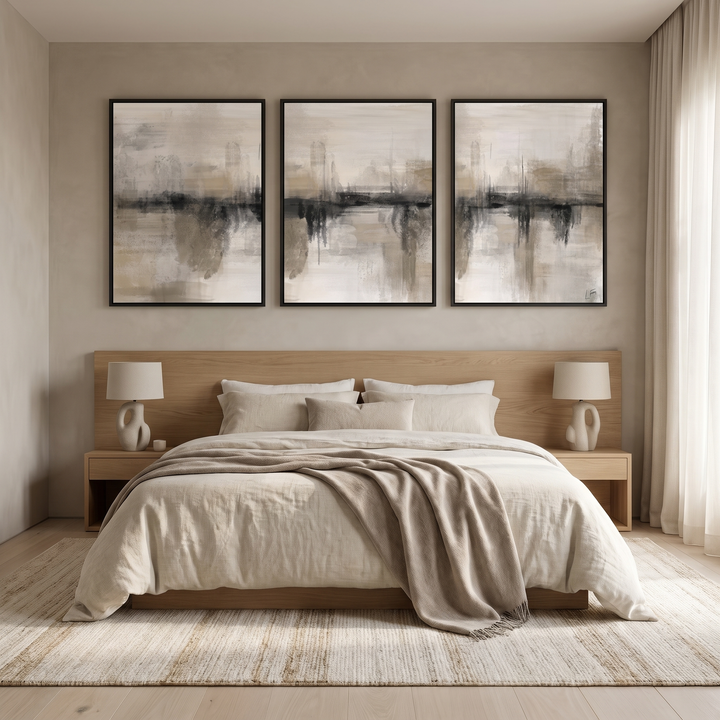 Nude Heaven set of 3 framed canvas in black frames above an oak bed with linen bedding - neutral abstract wall art triptych