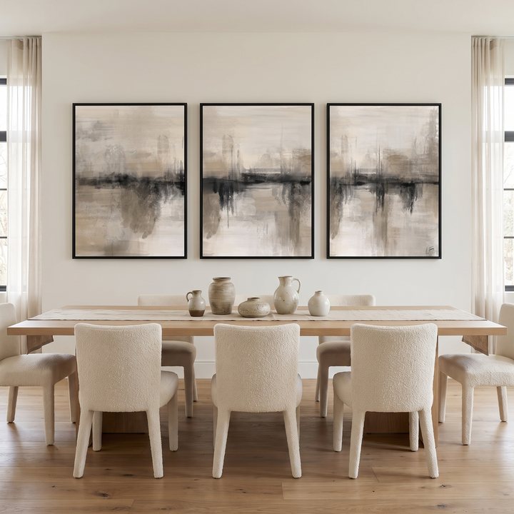 Nude Heaven set of 3 framed canvas in black frames above an oak dining table with boucle chairs - neutral abstract wall art triptych