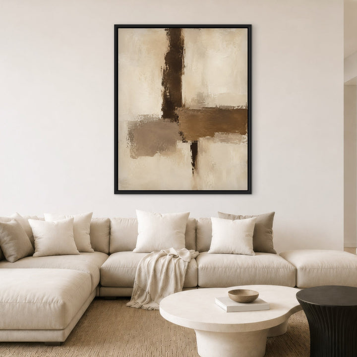 Parchment Cut neutral brown abstract framed canvas above cream sofa, black frame